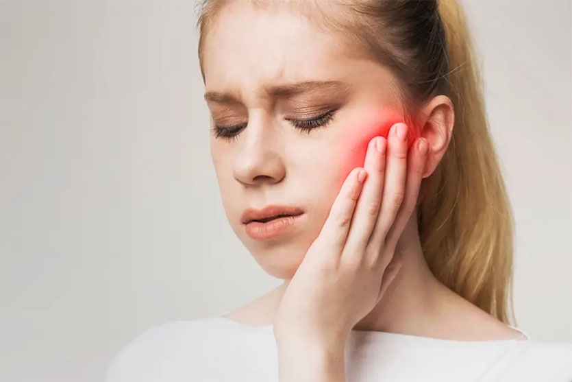 patient suffering from tooth pain