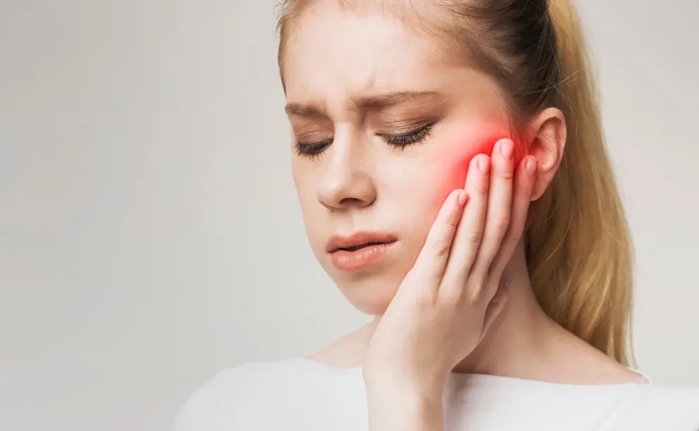 patient suffering from tooth pain